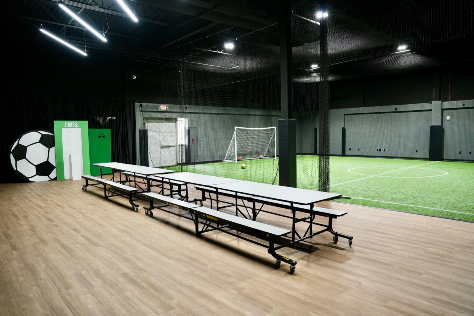 Party tables set up next to the soccer field at Just Play